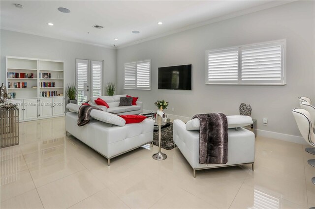 645 NE 9th Ave, Fort Lauderdale, FL 33304 - living area featuring ornamental molding, light tile patterned floors, recessed lighting, and baseboards