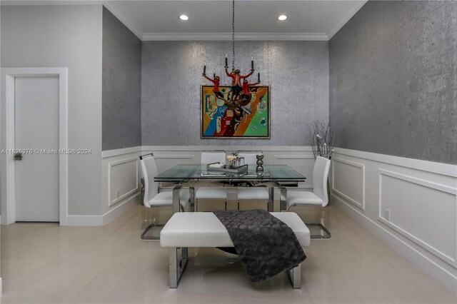 645 NE 9th Ave, Fort Lauderdale, FL 33304 - dining area with ornamental molding, recessed lighting, light tile patterned floors, a wainscoted wall, and a decorative wall