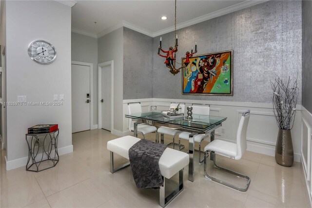645 NE 9th Ave, Fort Lauderdale, FL 33304 - dining area with ornamental molding, recessed lighting, a wainscoted wall, and a decorative wall