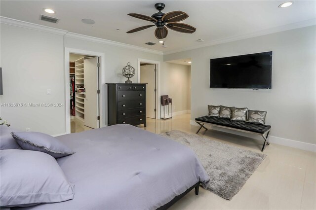 645 NE 9th Ave, Fort Lauderdale, FL 33304 - bedroom with a spacious closet, crown molding, baseboards, recessed lighting, and a closet