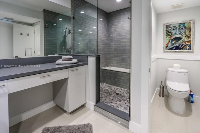 645 NE 9th Ave, Fort Lauderdale, FL 33304 - bathroom featuring vanity, a shower stall, toilet, tile patterned flooring, and recessed lighting