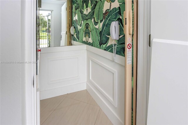 645 NE 9th Ave, Fort Lauderdale, FL 33304 - doorway to outside with light tile patterned floors