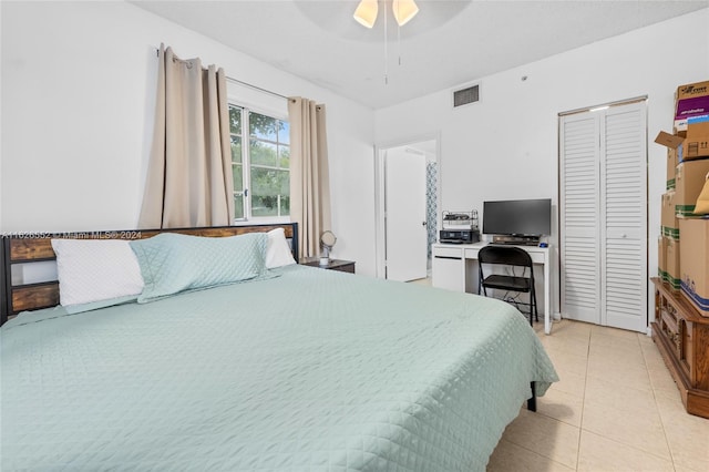 bedroom with ceiling fan and light tile patterned floors