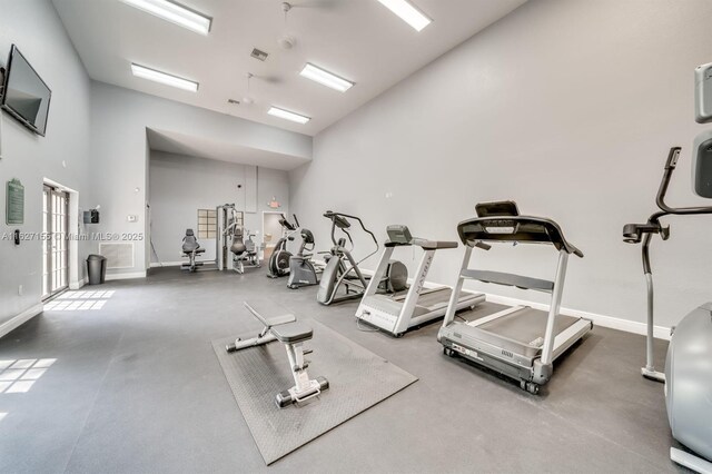 workout area featuring a high ceiling