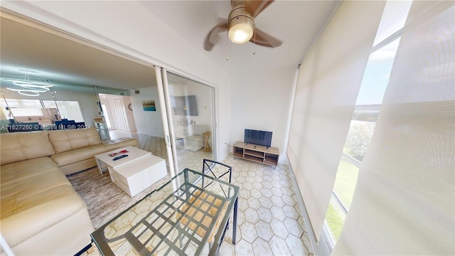 tiled living room with ceiling fan