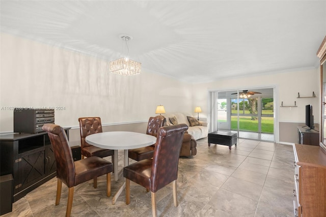 dining space featuring light tile patterned flooring, crown molding, and ceiling fan with notable chandelier