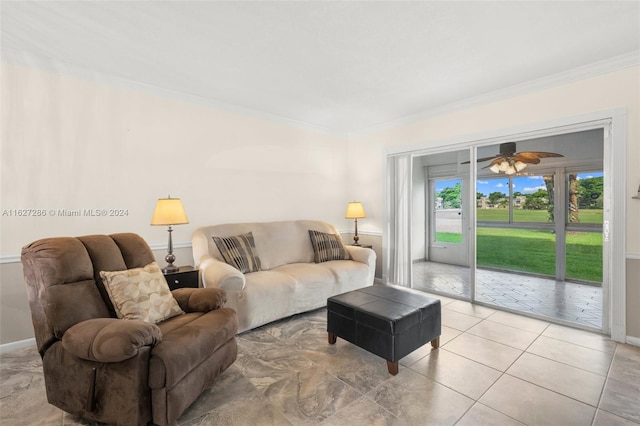 living room featuring light tile patterned flooring, crown molding, and ceiling fan