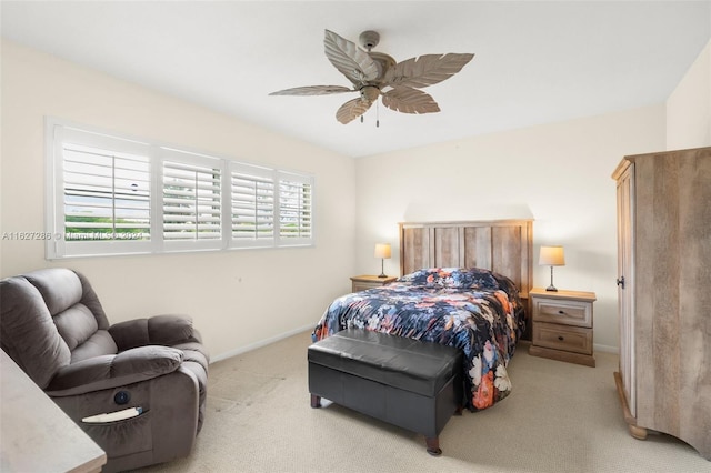 bedroom featuring light carpet and ceiling fan