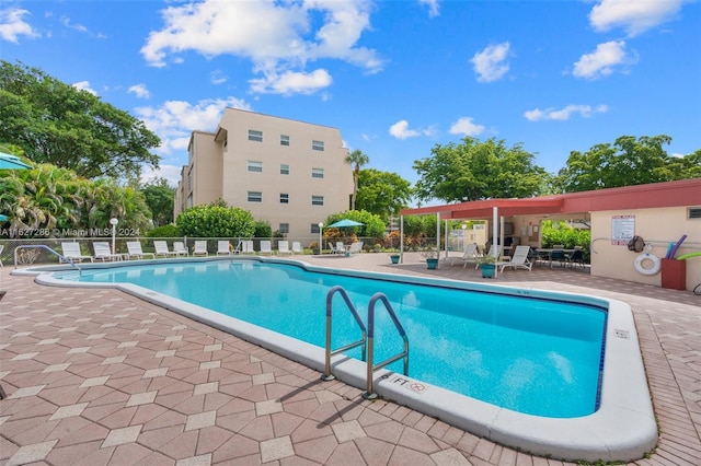 view of swimming pool featuring a patio