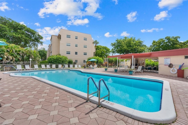 view of pool featuring a patio