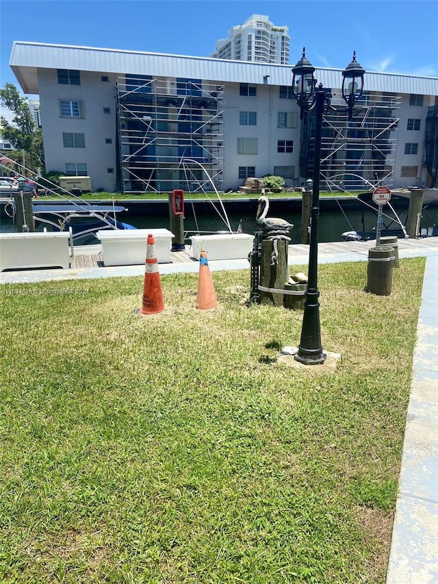 view of property's community with a lawn