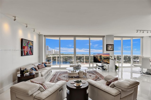 living room with expansive windows, rail lighting, and baseboards