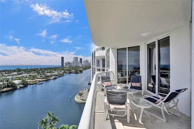 balcony featuring a water view