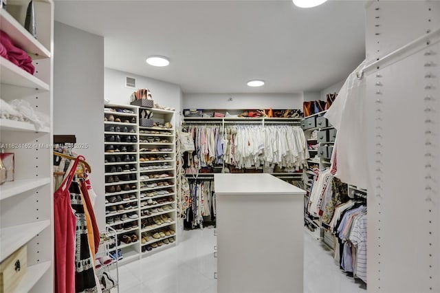 walk in closet featuring light tile patterned flooring and visible vents