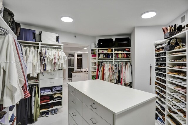 bathroom with ceiling fan, vanity, and tile patterned floors