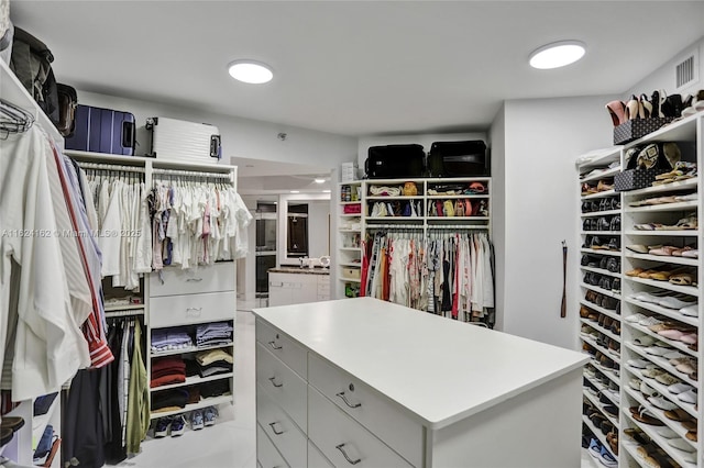 spacious closet featuring visible vents