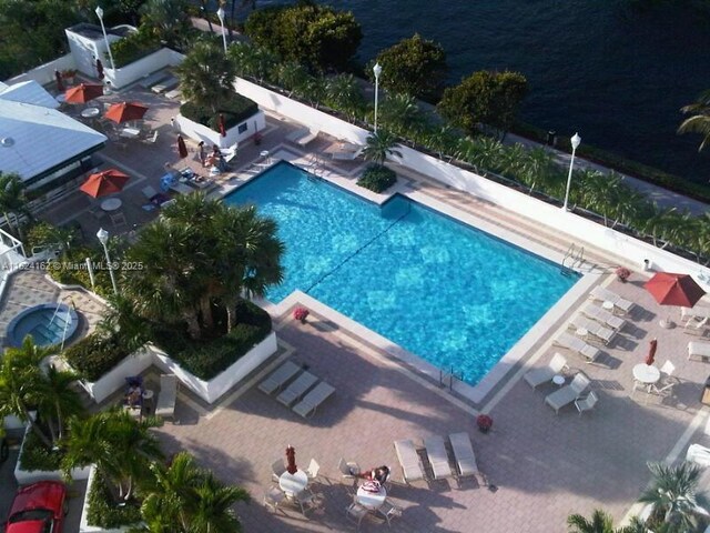 view of swimming pool with a patio