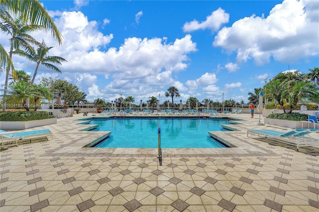 view of swimming pool featuring a patio area