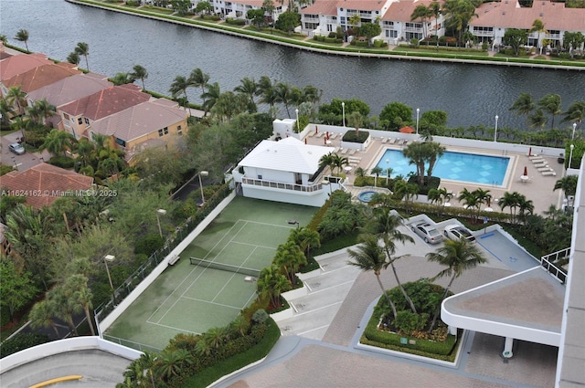 drone / aerial view featuring a residential view and a water view