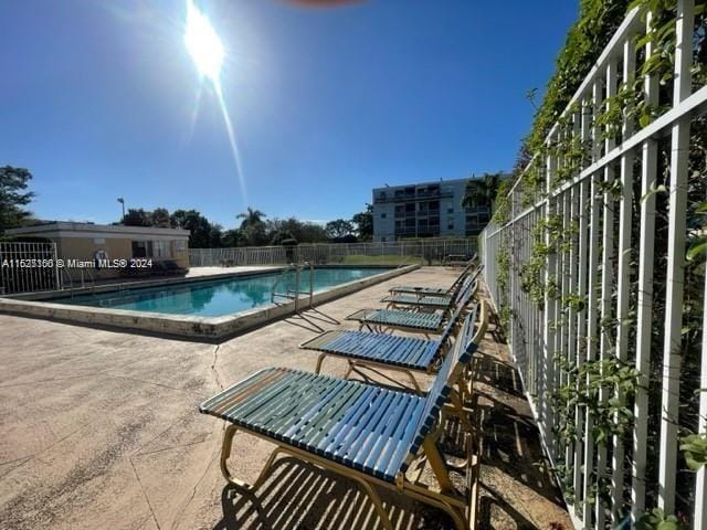 view of swimming pool with a patio