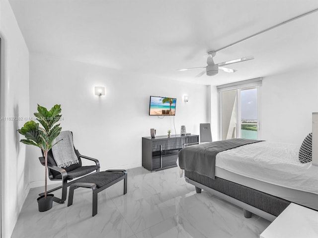 tiled bedroom featuring ceiling fan