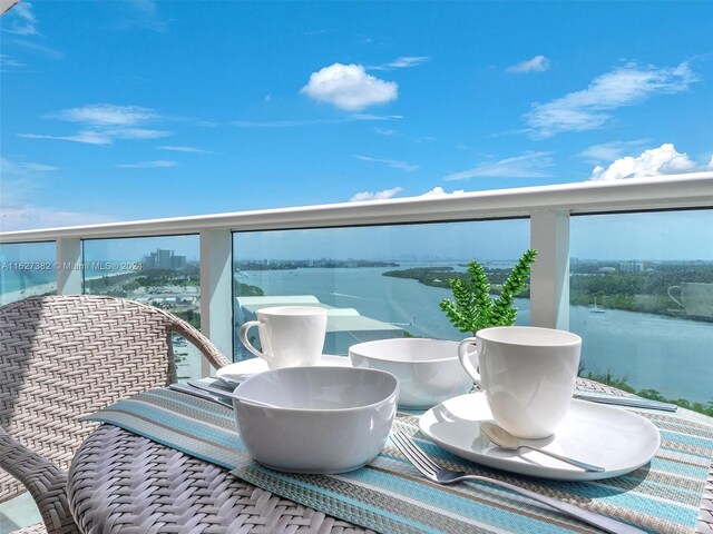 balcony featuring a water view