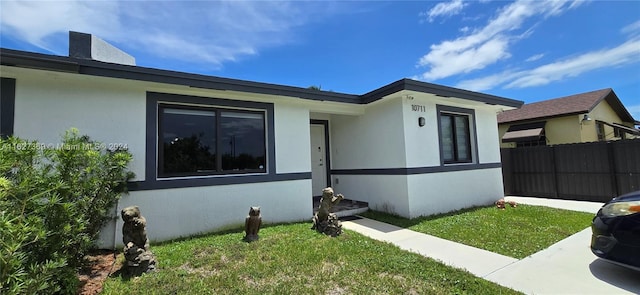 view of side of home featuring a lawn