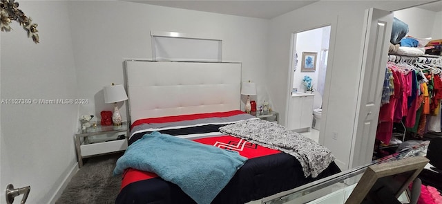 bedroom with carpet flooring and ensuite bath