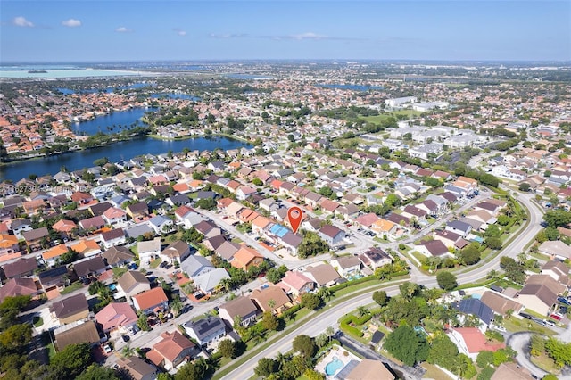 7949 NW 188th Ter, Hialeah, FL 33015 - aerial view of property and surrounding area featuring a nearby body of water and nearby suburban area