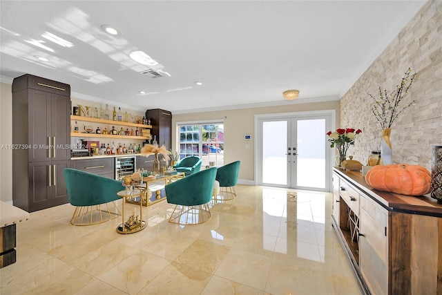 kitchen with ornamental molding, light tile patterned floors, french doors, and wine cooler