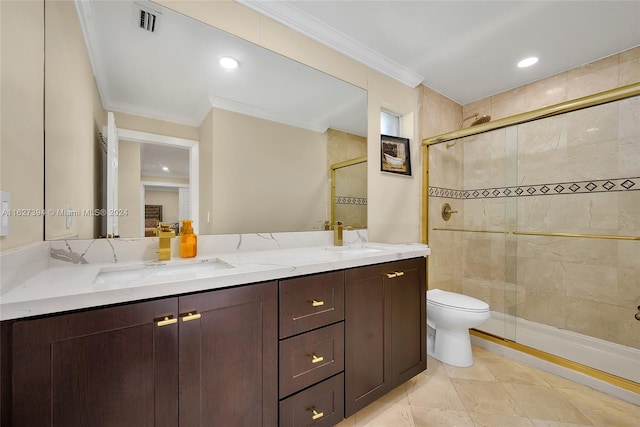 bathroom with a shower with door, crown molding, toilet, dual vanity, and tile patterned floors