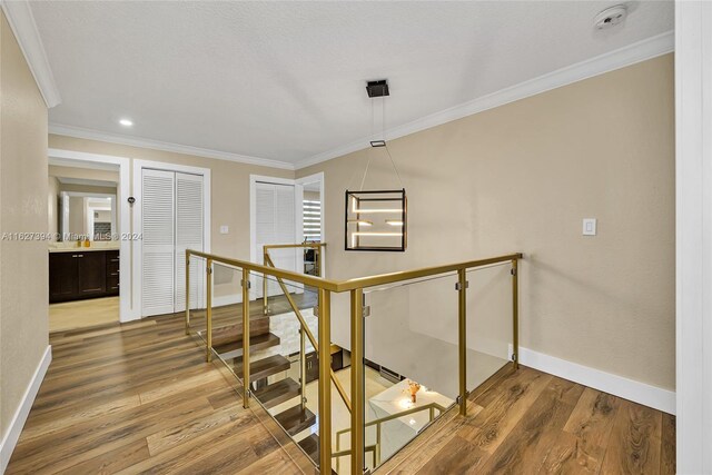 7949 NW 188th Ter, Hialeah, FL 33015 - stairs featuring crown molding and wood finished floors
