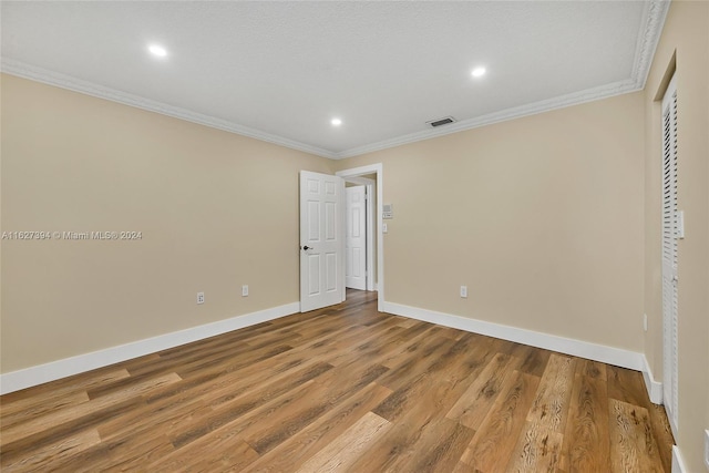 7949 NW 188th Ter, Hialeah, FL 33015 - unfurnished bedroom with crown molding, wood finished floors, and recessed lighting