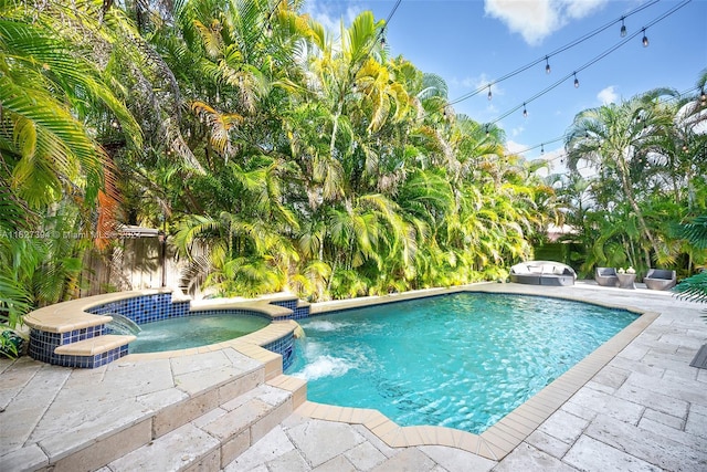 7949 NW 188th Ter, Hialeah, FL 33015 - view of swimming pool featuring a patio and a pool with connected hot tub