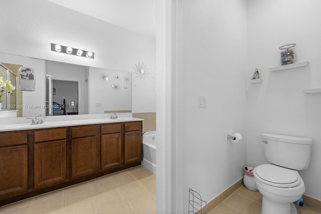 bathroom with double vanity, toilet, and tile patterned floors