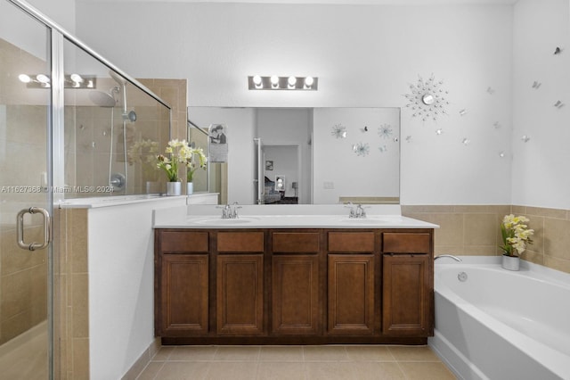 bathroom featuring dual vanity, plus walk in shower, and tile patterned floors