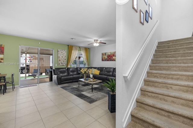 living room with ceiling fan and light tile patterned floors