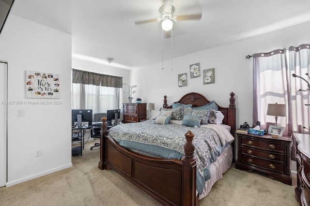 bedroom featuring ceiling fan and light colored carpet