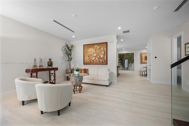 living room with light hardwood / wood-style floors