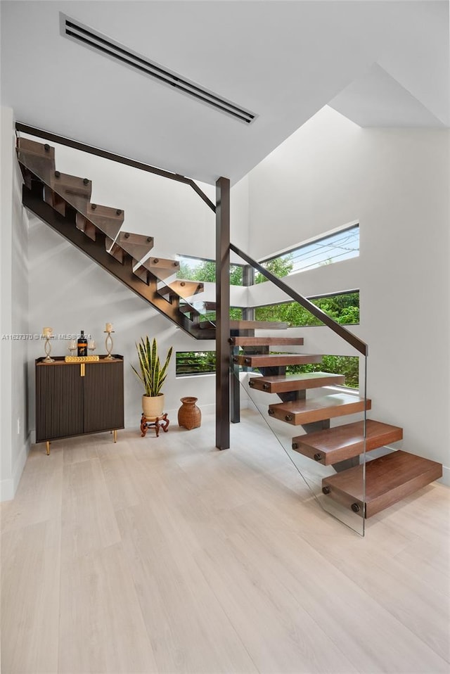 stairs with wood-type flooring