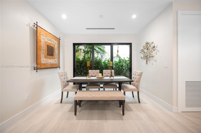 dining room with light hardwood / wood-style flooring