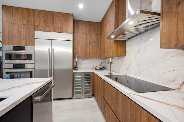 kitchen featuring backsplash, stainless steel appliances, beverage cooler, and wall chimney exhaust hood