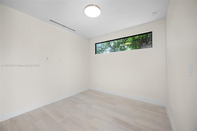 spare room featuring light hardwood / wood-style flooring