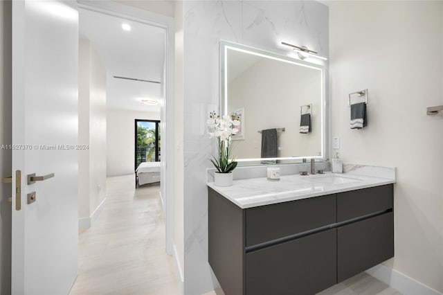 bathroom featuring hardwood / wood-style floors and vanity