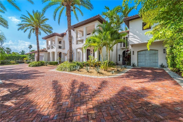 back of property with a patio and a balcony