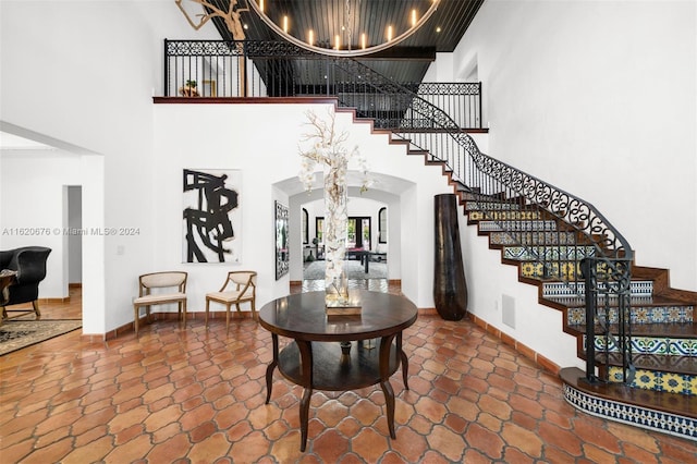 entrance foyer with a high ceiling and an inviting chandelier