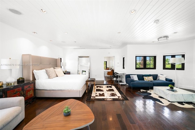 bedroom featuring dark hardwood / wood-style flooring and wood ceiling