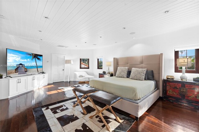 bedroom with wood ceiling and dark hardwood / wood-style floors