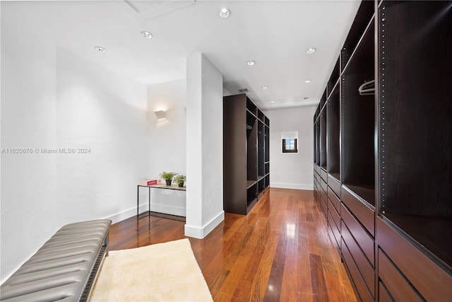 hall with dark hardwood / wood-style floors