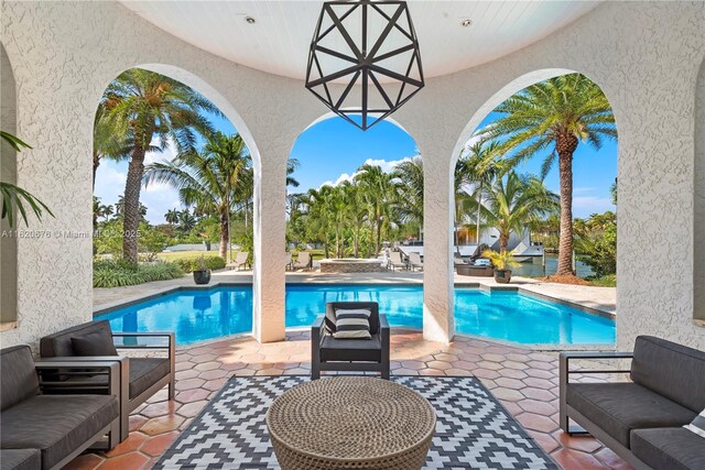 view of swimming pool with a patio area